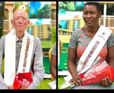 North A young man with albinism wearing a long grey shirt and a sash around his neck with the words Mr Ability Northern region 2022 and a young woman with hearing impairment in a grey and organge dress with a sash over her right shoulder saying Miss Ability Northern region 2022. They are both holding red roses