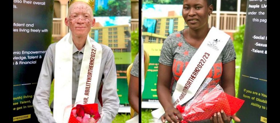 A young man with albinism wearing a long grey shirt and a sash around his neck with the words Mr Ability Northern region 2022 and a young woman with hearing impairment in a grey and organge dress with a sash over her right shoulder saying Miss Ability Northern region 2022. They are both holding red roses