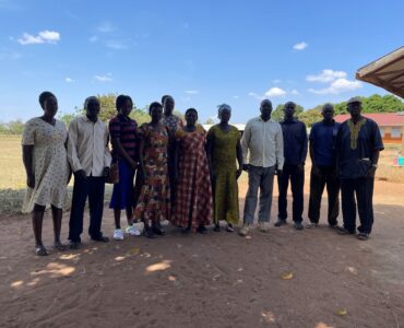 The group photo containing 11 people. They are a mix of teachers and parents of children with disabilities at Paipir Primary School