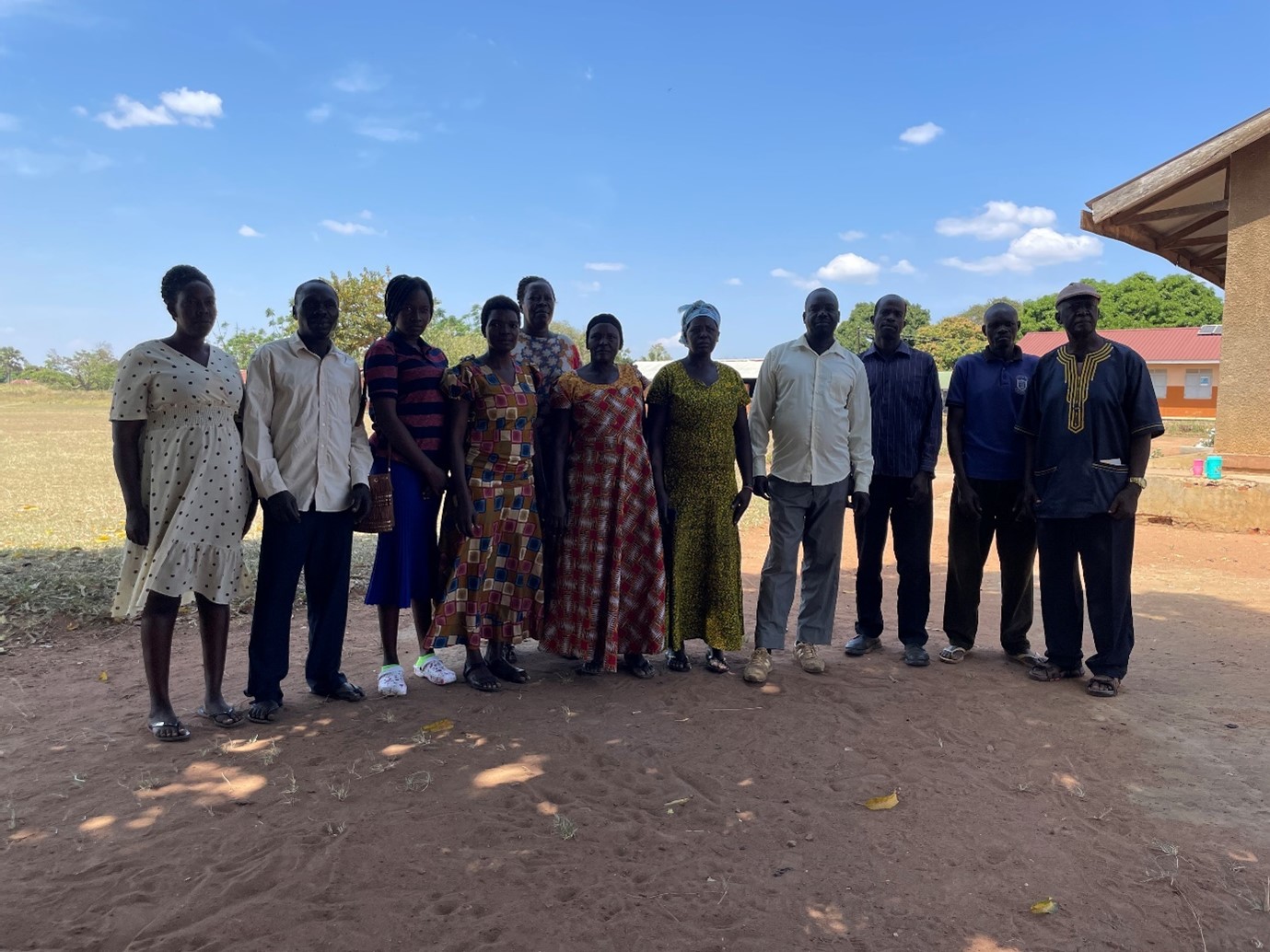 The group photo containing 11 people. They are a mix of teachers and parents of children with disabilities at Paipir Primary School